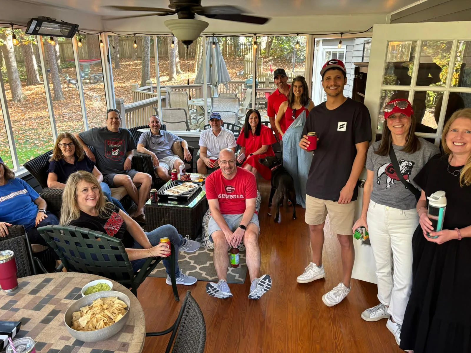 A group gathers on a porch for a JGather event
