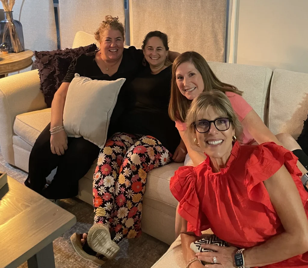 Summer 2024 JGather Adults Smiling Sitting on Sofa