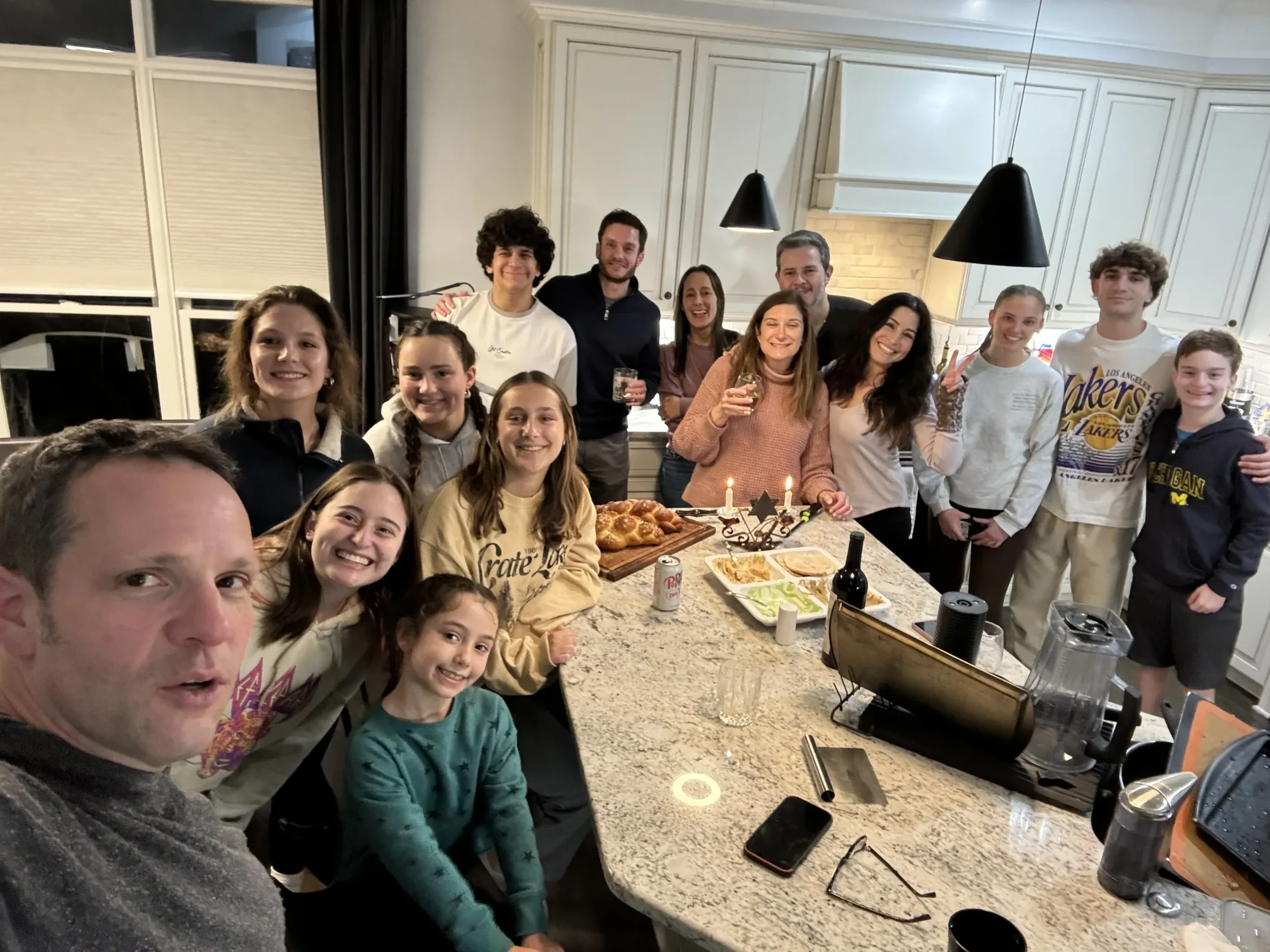 Teens Gathered Around Table at JGather event