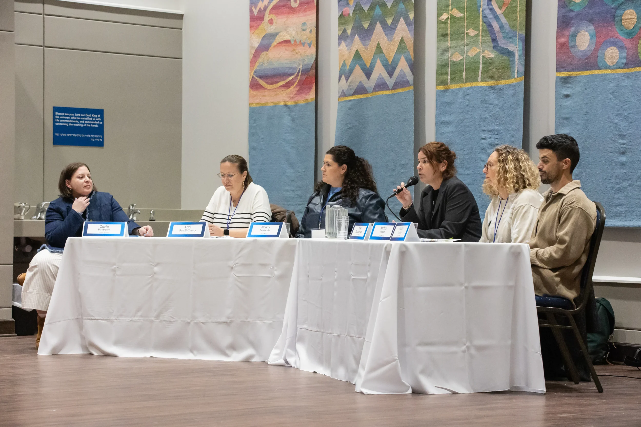 Carla and fellow panelists participate in JGather's Gather & Connect: Panelists & Parade discussion, exploring Jewish identity, justice, and the arts before attendees.