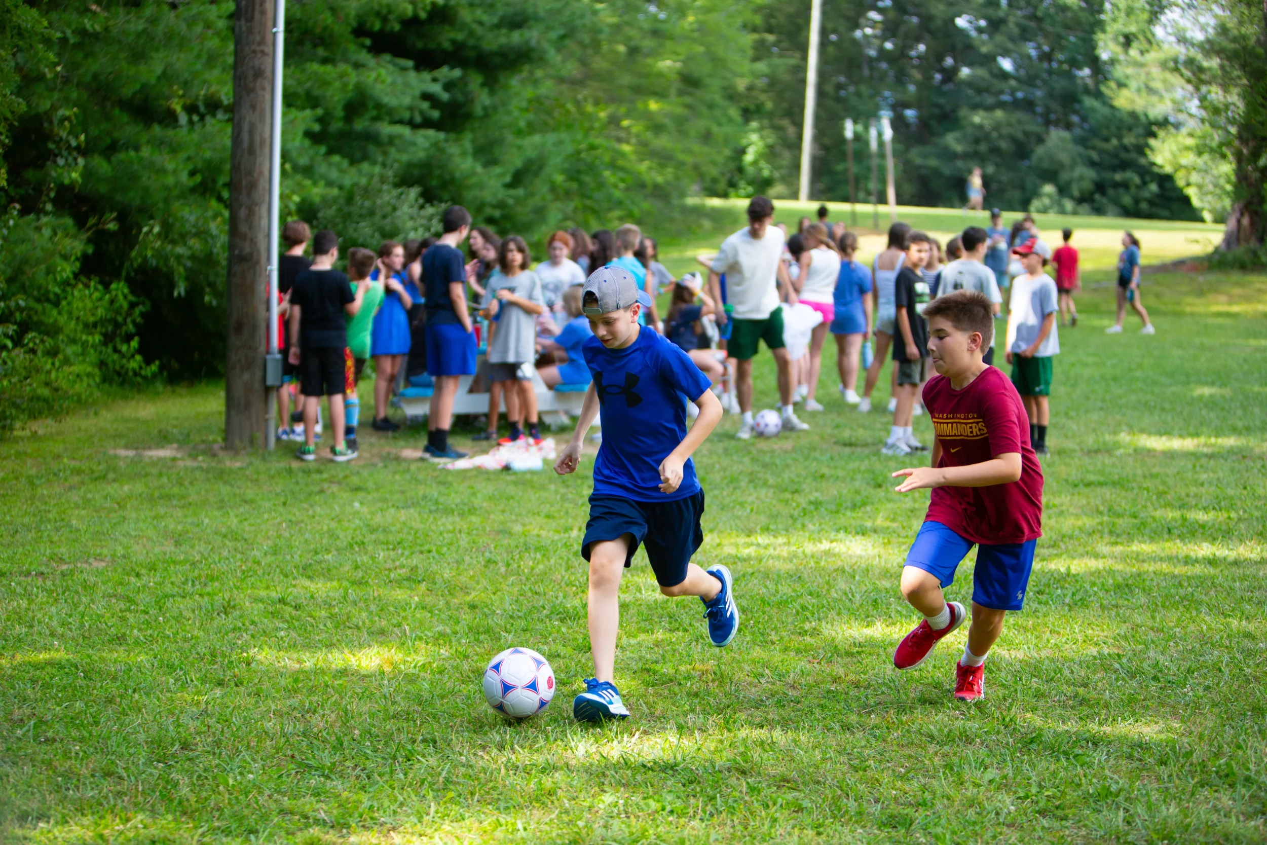 Boys playing soccer at camp