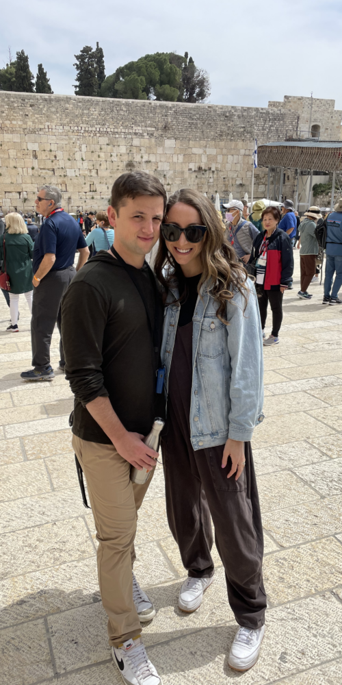 allison-sam-honeymoon-israel-posing-in-front-of-western-wall