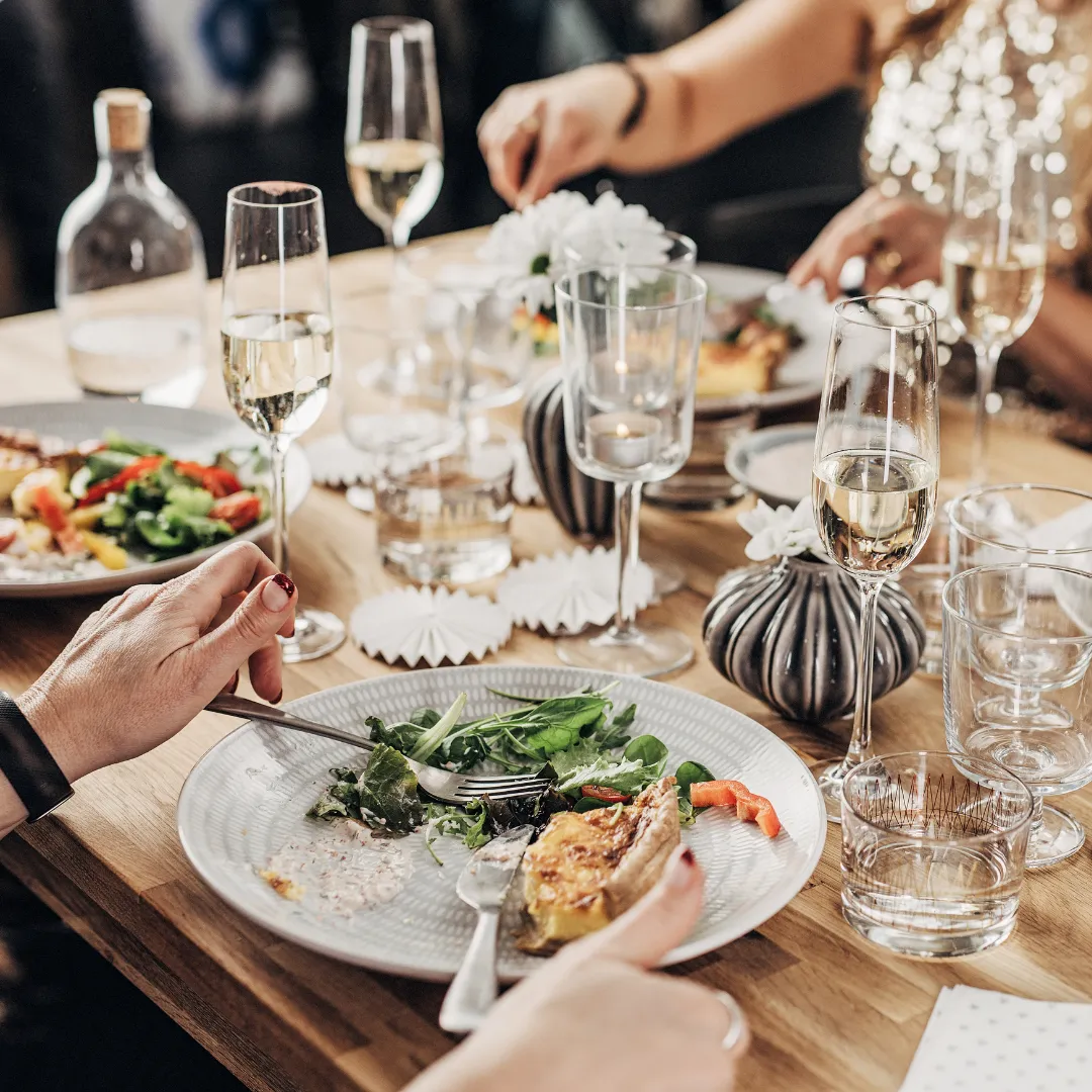 A group of people have dinner together