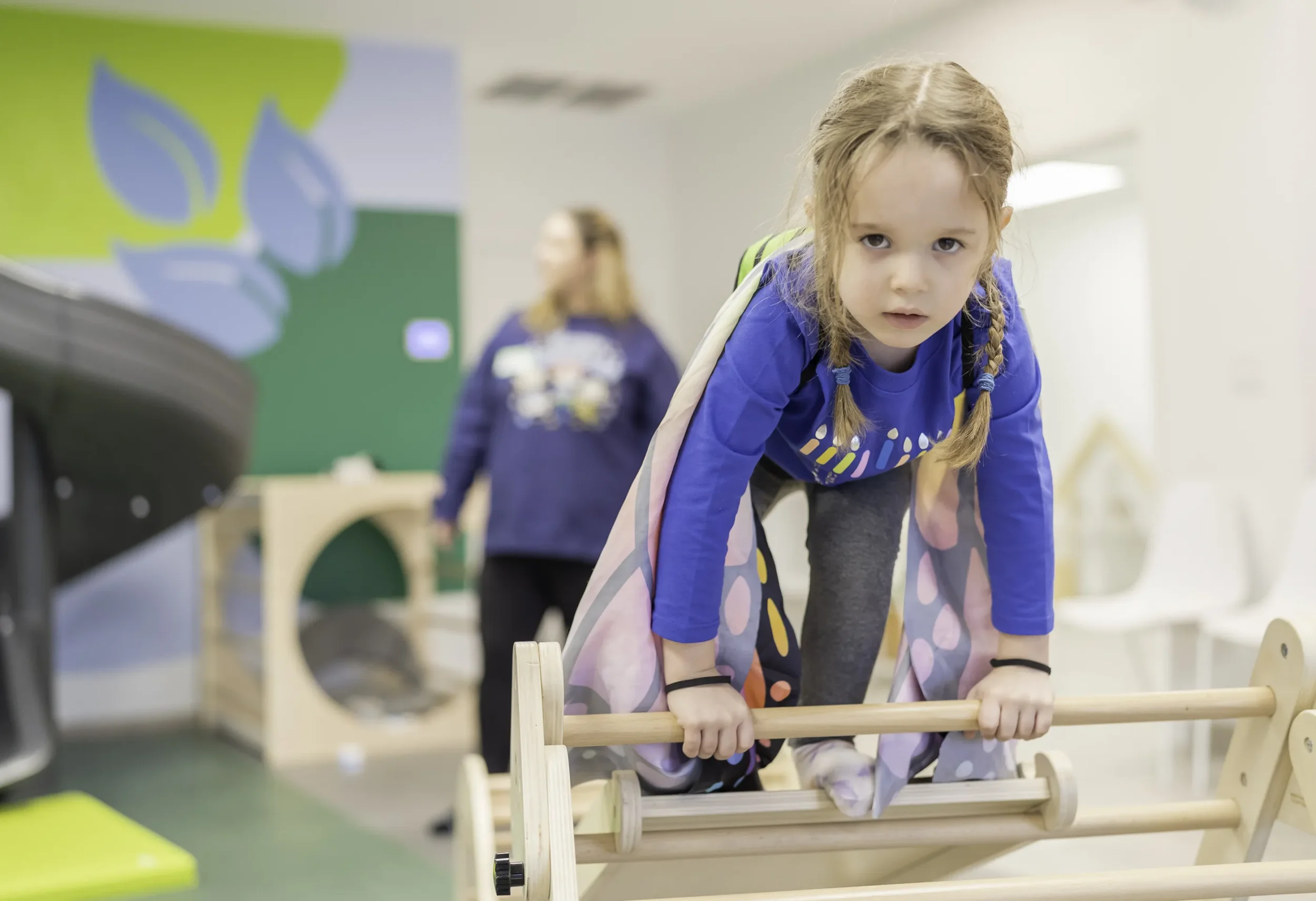 Little girl climbing on indoor playground