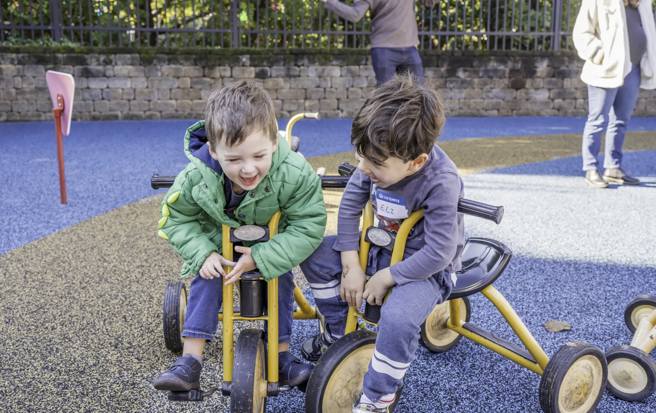 Two Boys Smiling at PJ Library Get-Together on Playground