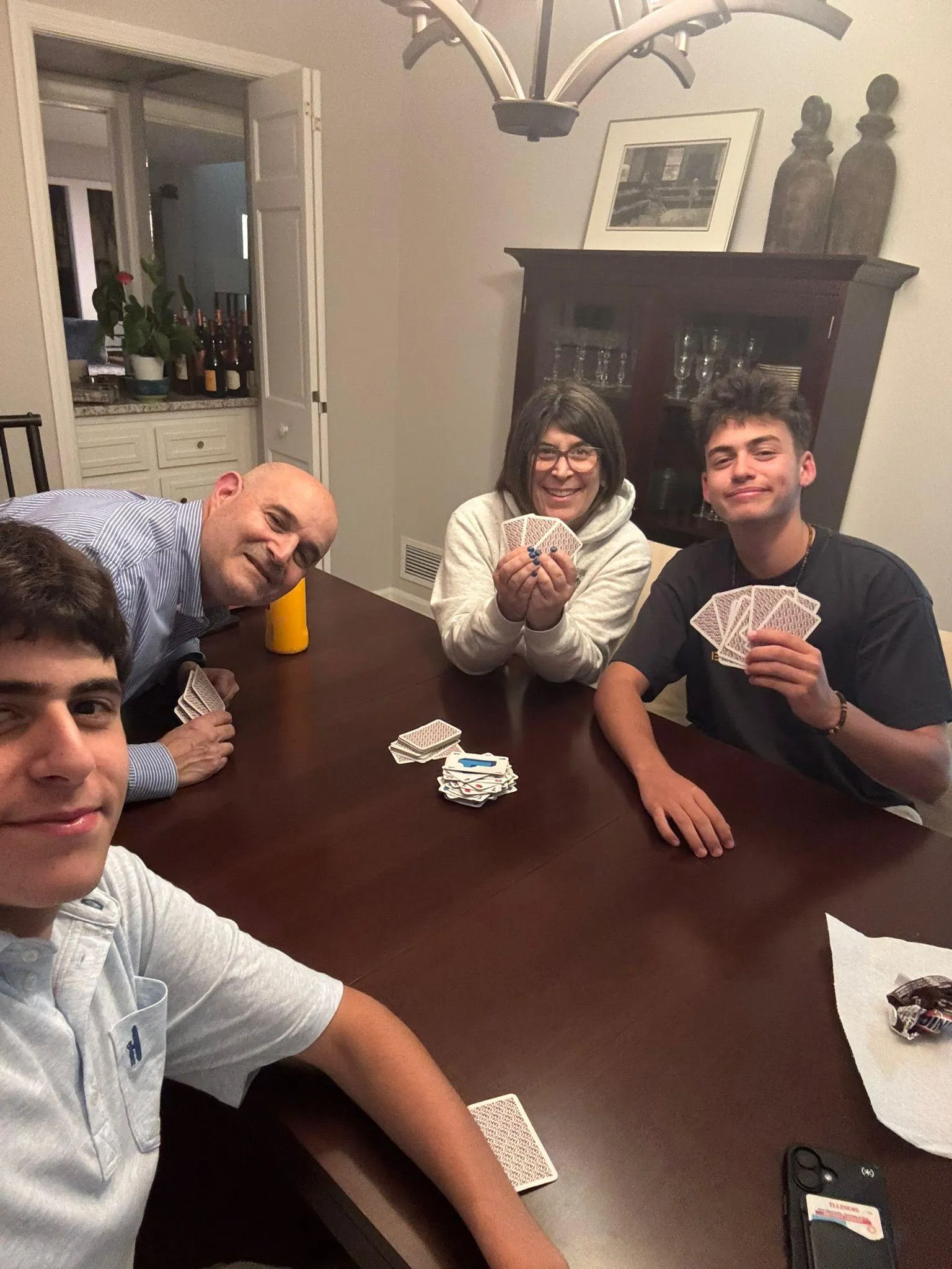Rotem playing cards with his host family