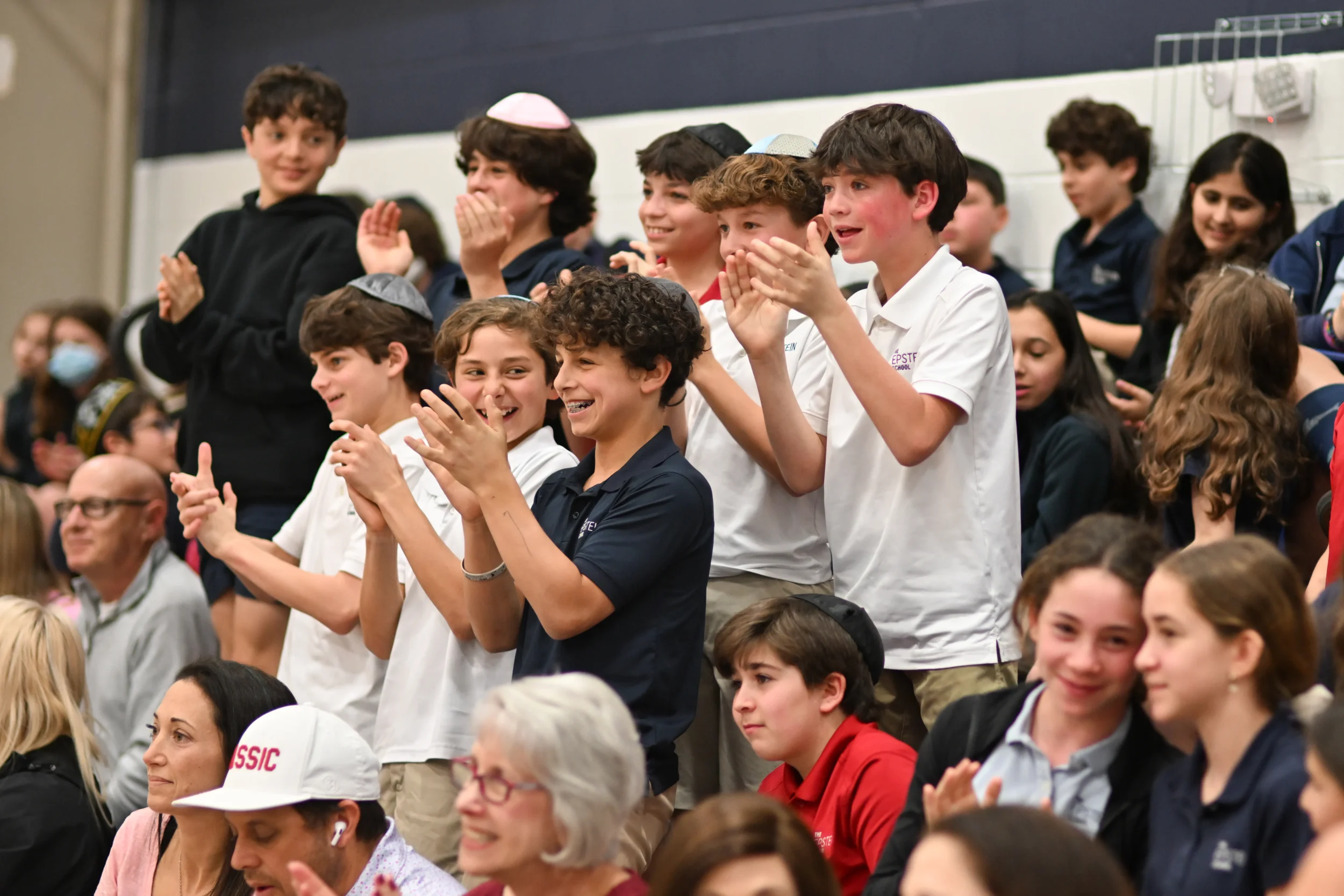 Atlanta Jewish school students clapping at school event
