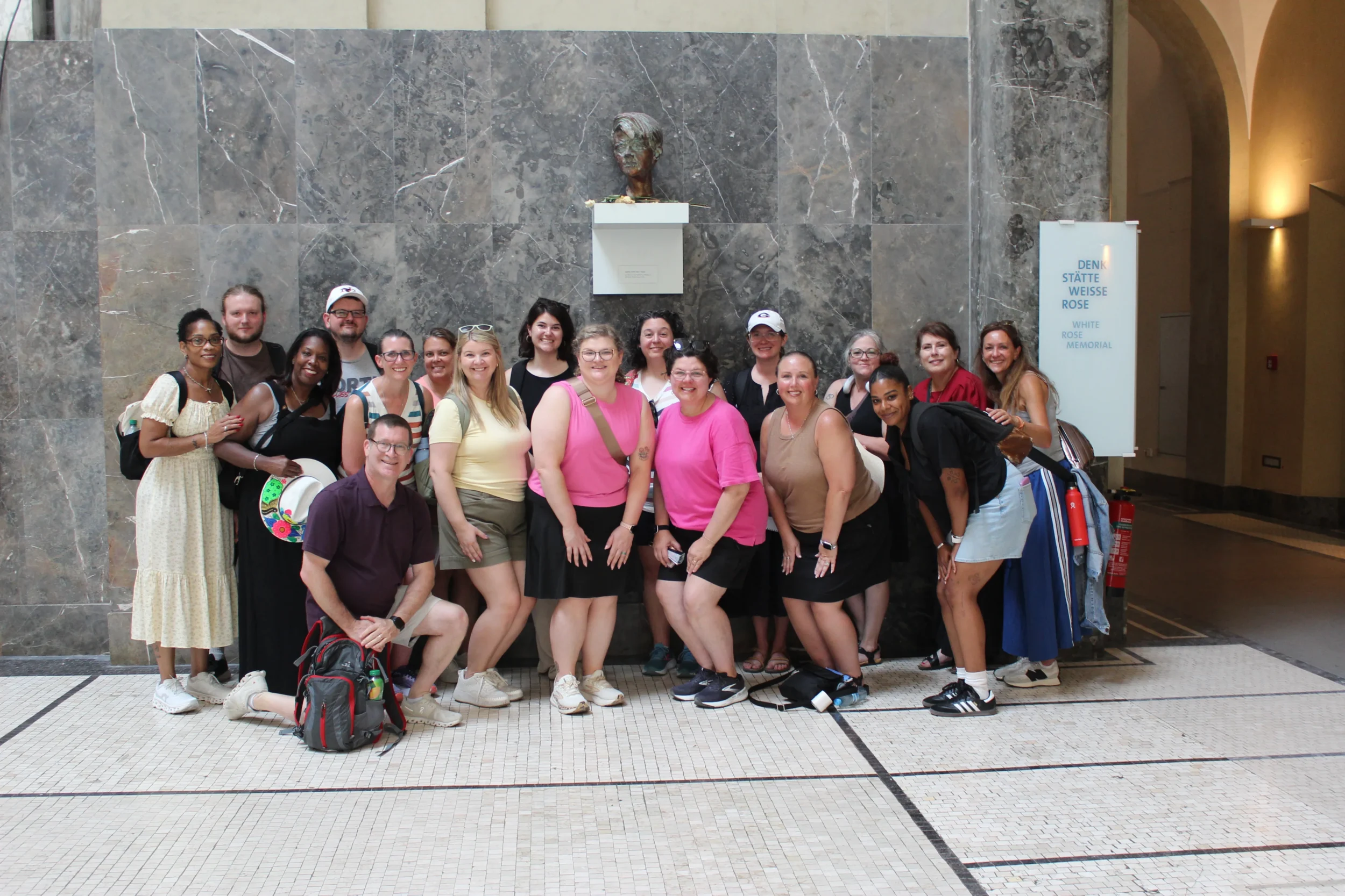 Teacher Ambassador Program participants pose together at the White Rose Memorial in Munich during their Holocaust education journey through Germany.