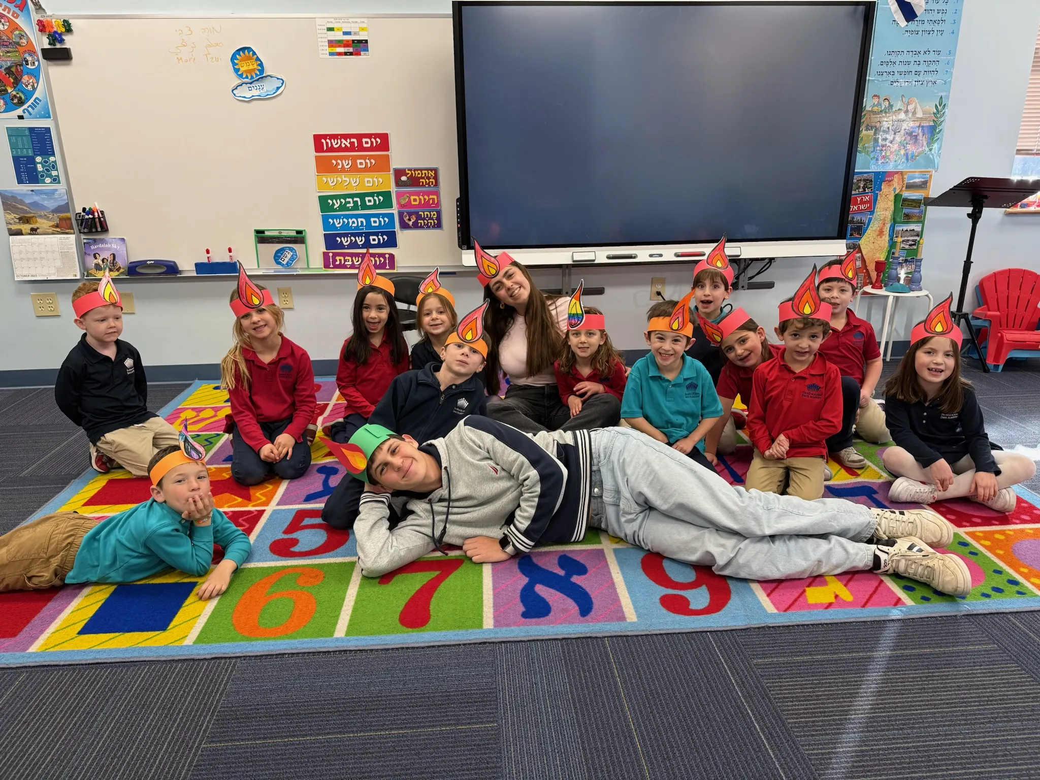 Two 2025-2026 Shinshinim with children at school wearing costume