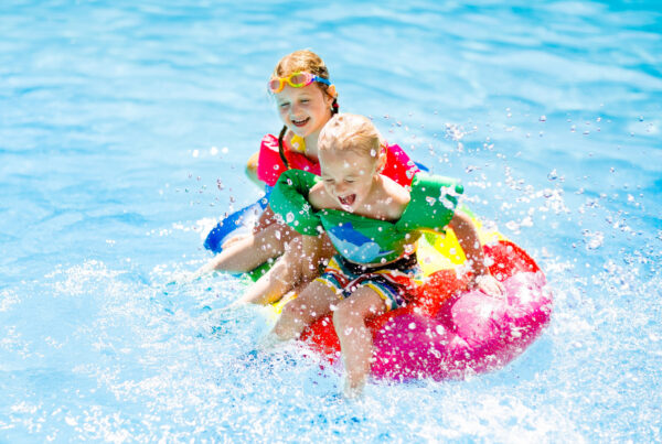 kids-splashing-in-pool-on-float